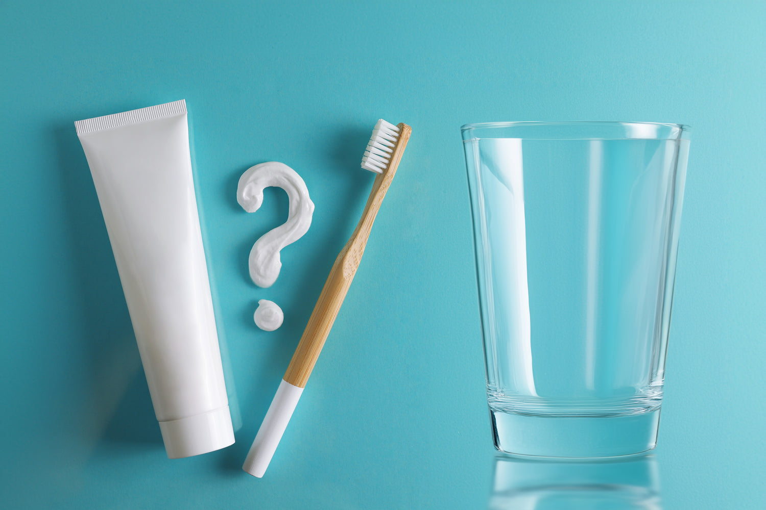 Reverse Osmosis and Fluoride -- Toothbrush and toothpaste next to a clean glass of water