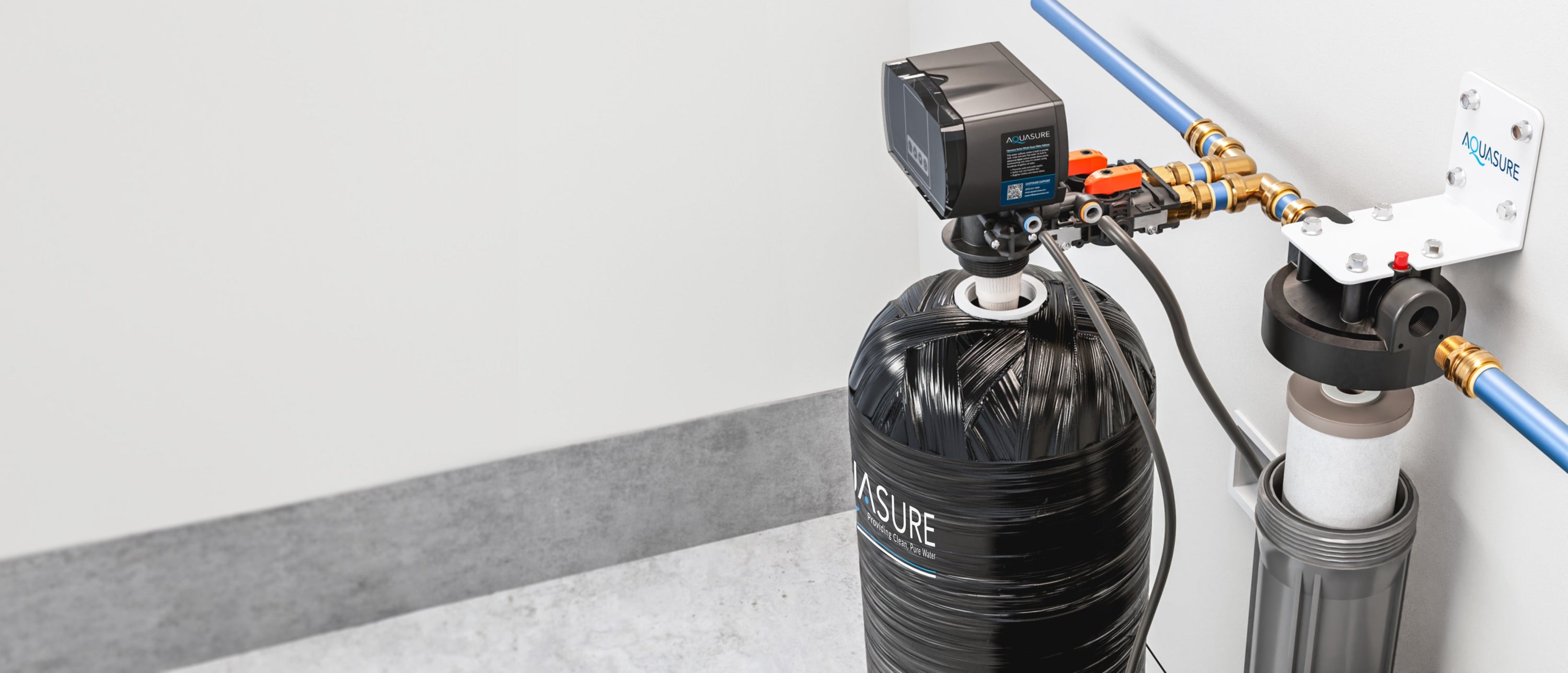 overhead shot of a harmony water softener and fortitude pre-filter being installed