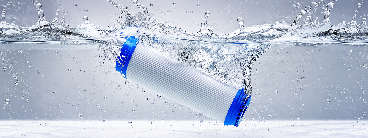 a water filter cartridge submerged in clean water.