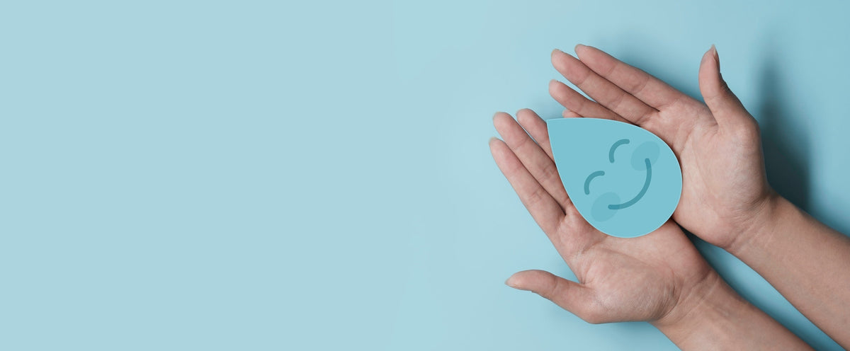  a blue background with a smiling waterdrop cutout in a woman’s hands.