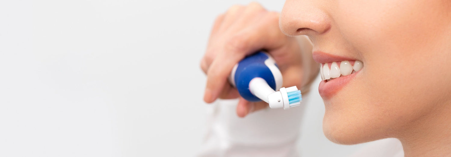 woman brushing her teeth